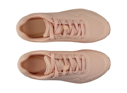 Pair of woman's sneakers isolated from background. Pink color. Top view