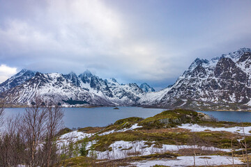 Snow capped mountains near harbor in Lofoten, Norway