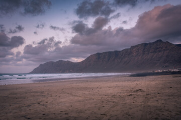 Fototapeta na wymiar The amazing Famara beach on the Atlantic Ocean in Lanzarote, Canary Islands, Spain