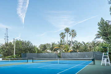 Tennis court with palm trees in Florida resort