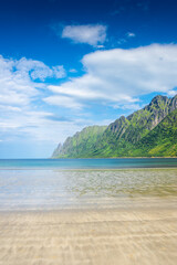 The crystal clear water of the Ersfjordstranda beach in Senja Island,  Norway
