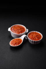 Delicious spicy tomato sauce with pepper, garlic, salt, spices and herbs