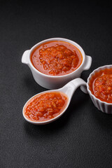 Delicious spicy tomato sauce with pepper, garlic, salt, spices and herbs