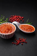 Delicious spicy tomato sauce with pepper, garlic, salt, spices and herbs