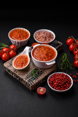 Delicious spicy tomato sauce with pepper, garlic, salt, spices and herbs