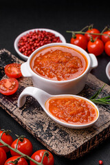 Delicious spicy tomato sauce with pepper, garlic, salt, spices and herbs
