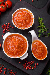 Delicious spicy tomato sauce with pepper, garlic, salt, spices and herbs