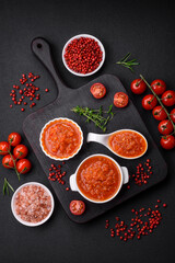 Delicious spicy tomato sauce with pepper, garlic, salt, spices and herbs
