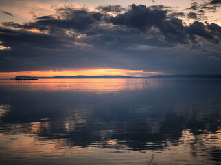 Fantastic sunset over lake Balaton with swan