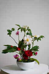 Easy Homemade bouquet with mixed flowers on light background