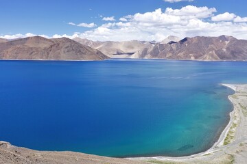 Fototapeta na wymiar Experience the mesmerizing beauty of Pangong Tso lake in Ladakh, India, with its panoramic sapphire blue waters. 