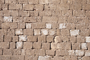 Old brown limestone wall background
