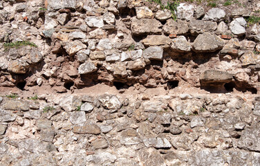 Old jagged stone wall background