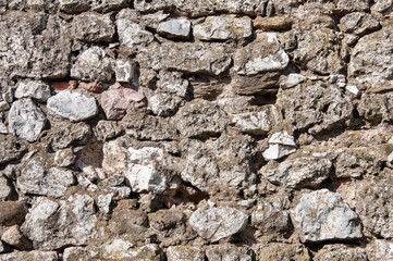 Old rough stone wall background