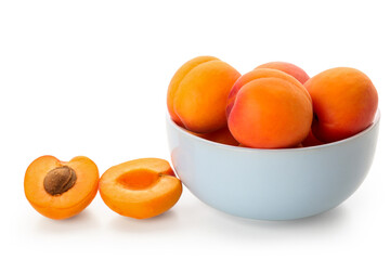 Bowl with ripe apricots isolated on white background