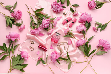 Composition with stylish female accessories, cosmetics and beautiful peony flowers on pink background