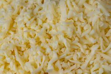 Hard cheese with holes grated into thin small slices