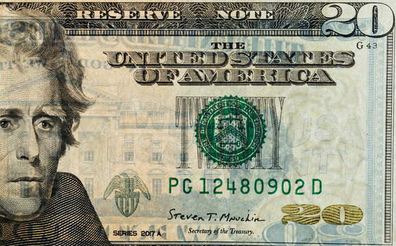 a close-up of twenty American dollars transparent in the light