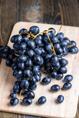 Unwashed blue grapes in the dust