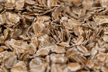 a bunch of fresh dry oatmeal flakes for making porridge