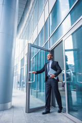 Afro American businessman with gadget