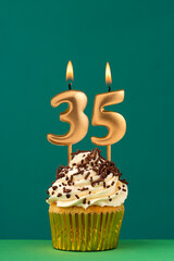 Birthday card with candle number 35 - Green background