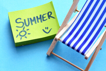 The word Summer on a small piece of paper.