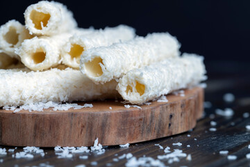 Waffle tubes with butter cream and coconut sprinkles