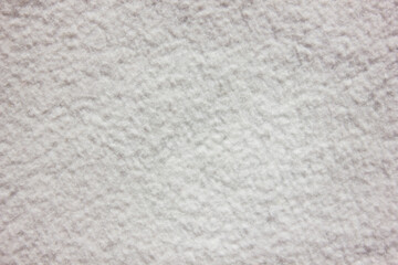 White delicate soft plush fleece fabric texture background. Background pattern of soft warm material