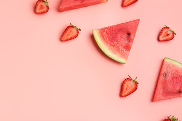 Pieces of fresh watermelon and strawberries on pink background