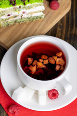 Red raspberry tea with pieces of fruit and berries