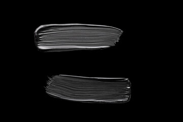 black mascara swatch on a black background