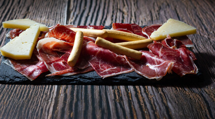 An Iberian delight: Premium quality acorn-fed ham and pure cured sheep's cheese. Spanish gastronomy.
