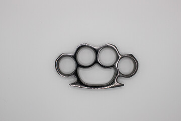 Silver Brass Knuckles Layed Down. Isolated on White Background