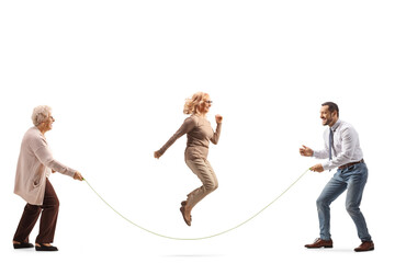 Senior woman and a young man holding a rope and woman skipping