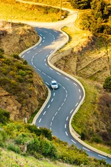 Zelfklevend Fotobehang Winding asphalt road in France © Voyagerix