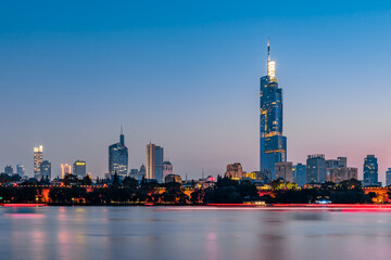 Fototapeta premium Early morning scenery of Xuanwu Lake and city skyline in Nanjing, China