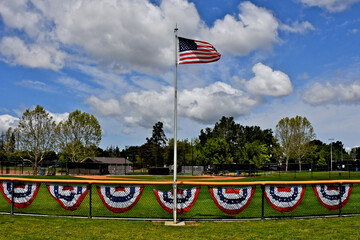 Boys of Summer. Little league baseball field ready for opening day decked out with patriotic bunting and flag