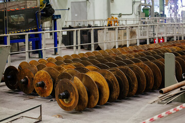 Augers. Screw conveyor machine parts in metallurgical factory