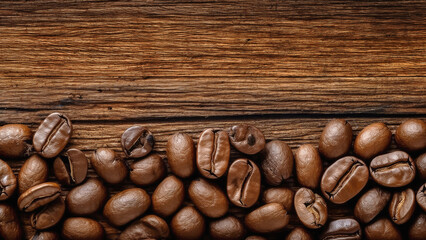 Roasted coffee beans artfully arranged on rustic wooden plank, view from top