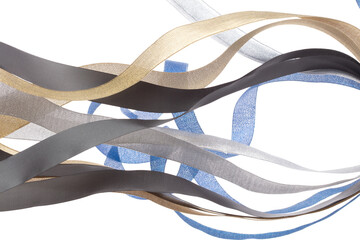 Colorful ribbon long straight fly in air with curve roll shiny. Blue silver gold black ribbon for present gift birthday party to wrap around decorate, blow fly in wind. White background isolated