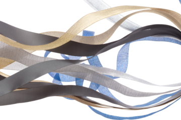 Colorful ribbon long straight fly in air with curve roll shiny. Blue silver gold black ribbon for present gift birthday party to wrap around decorate, blow fly in wind. White background isolated