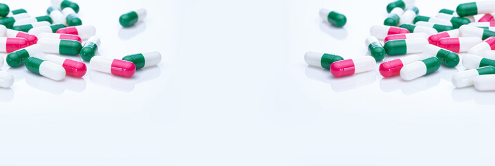 Capsules pill spread on white background. Prescription drugs. Capsule pill frame banner. Green,...