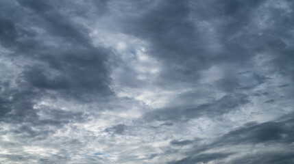 Overcast sky. Dramatic gray sky and dark clouds before rain in rainy season. Cloudy and moody sky. Storm sky. Gloomy and moody background. Overcast clouds. Sad, lonely, and death abstract background.