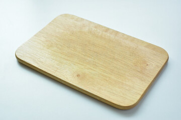 brown wooden cutting board isolated on white background, plank wood for cooking in the kitchen