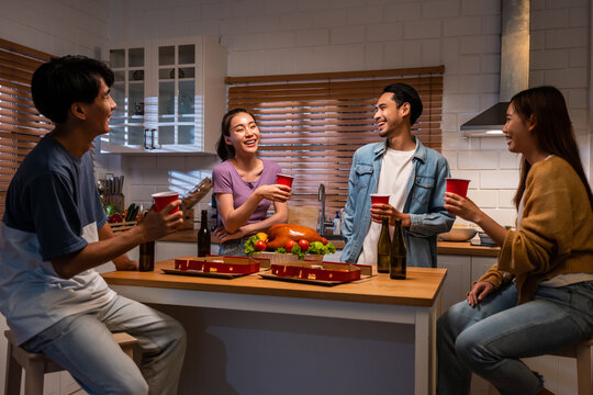 Group Of Asian Friend Having Dinner, Enjoy Evening Party Together At Home. 