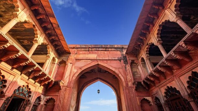 Agra fort gate time lapse on a blue sky day. Agra, India.