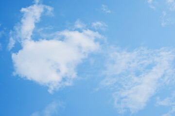 beautiful blue sky and white fluffy cloud with sunrise in the morning, natural background