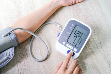 Man check blood pressure monitor and heart rate monitor with digital pressure gauge. Health care and  Medical concept