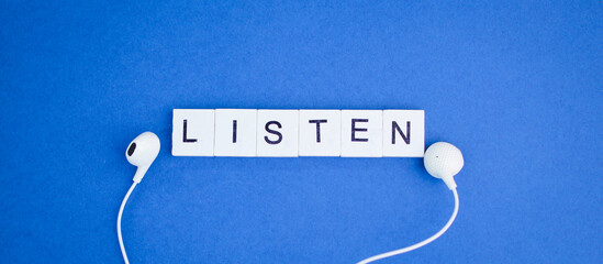 letters of the alphabet with the word listen. the concept of hearing or hearing something